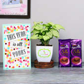 Sweet Green New Year Combo - Foliage Plant Indoors in Blossom Vase with New Year Greeting Card and 2 Dairy Milk Silk Chocolates