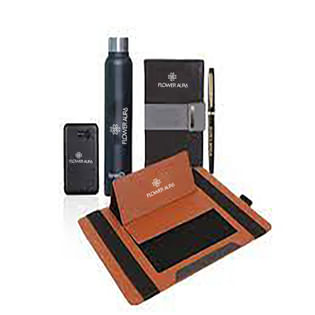 A leather wallet, pen, phone, and other items