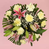 Arrangement of 4 Pink Lilies and 10 Yellow Carnations in a Glass Vase