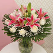 Arrangement of 4 Pink Lilies and 12 White Carnations