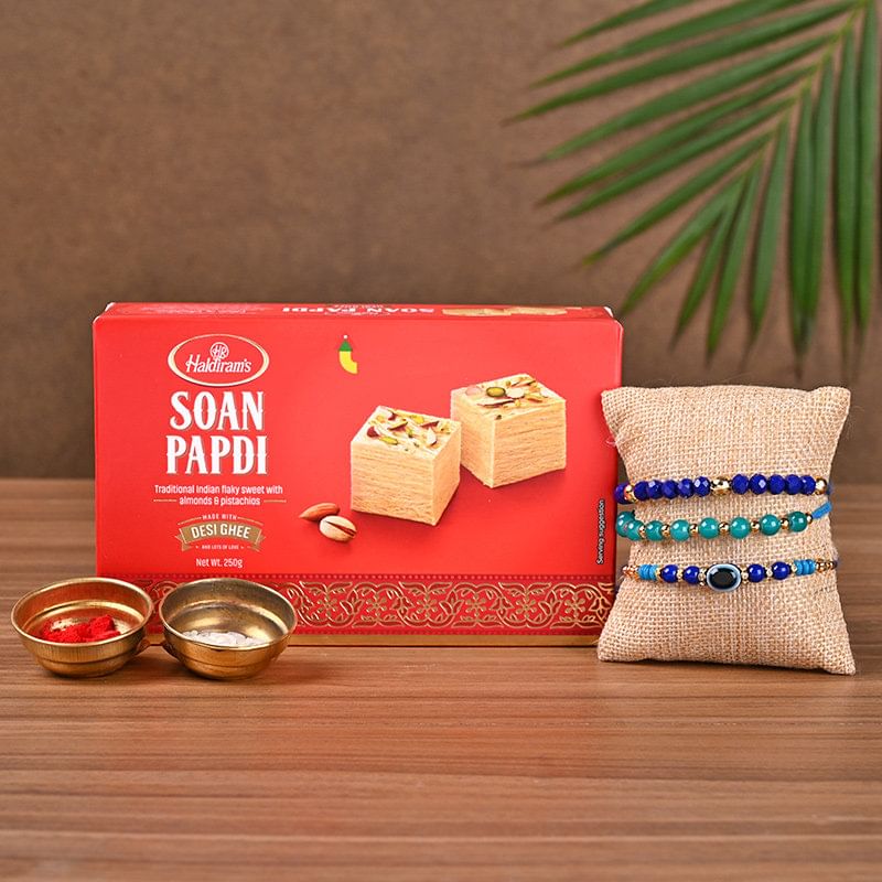Three Designer Rakhi And Sweet Treats to Germany