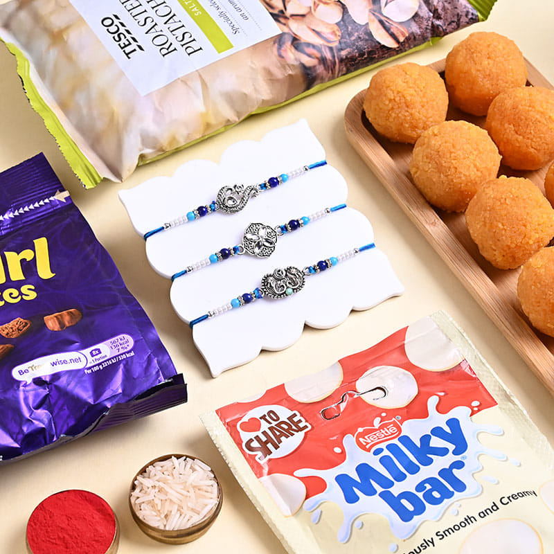Three Designer Rakhis N Festive Treats Hamper