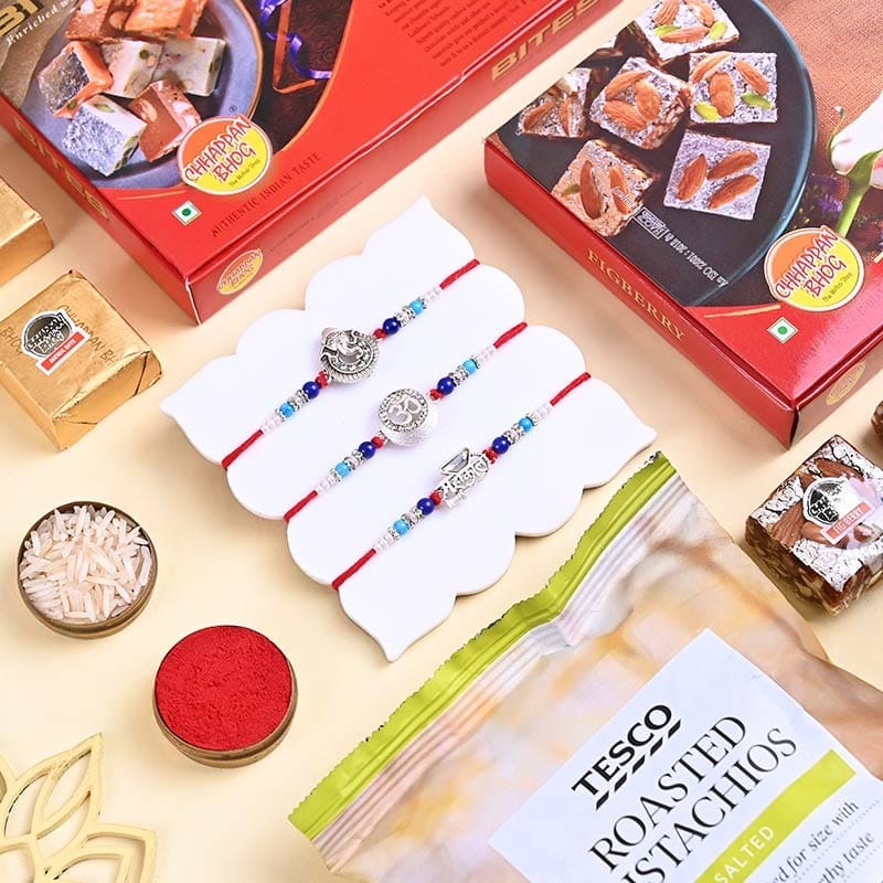 Three Designer Rakhis With Sweets N Pistachios
