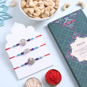 Three Divine Silver Rakhis N Premium Treats Hamper