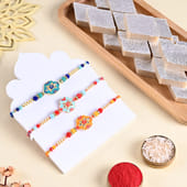 Three Floral Designer Rakhis With Kaju Katli