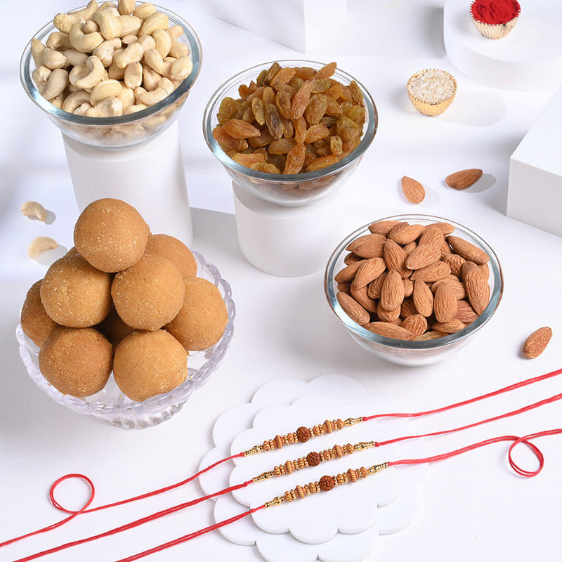Three Sacred Rudraksha Rakhis with Festive Treats