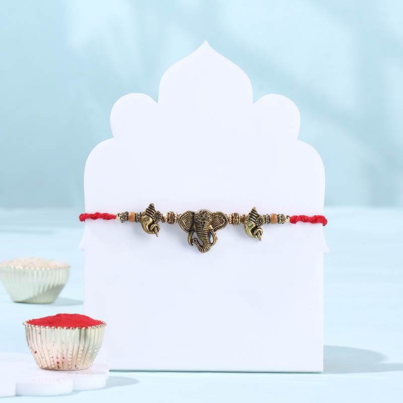 Trinetra Ganesha Rakhi With Chana Badam Bite