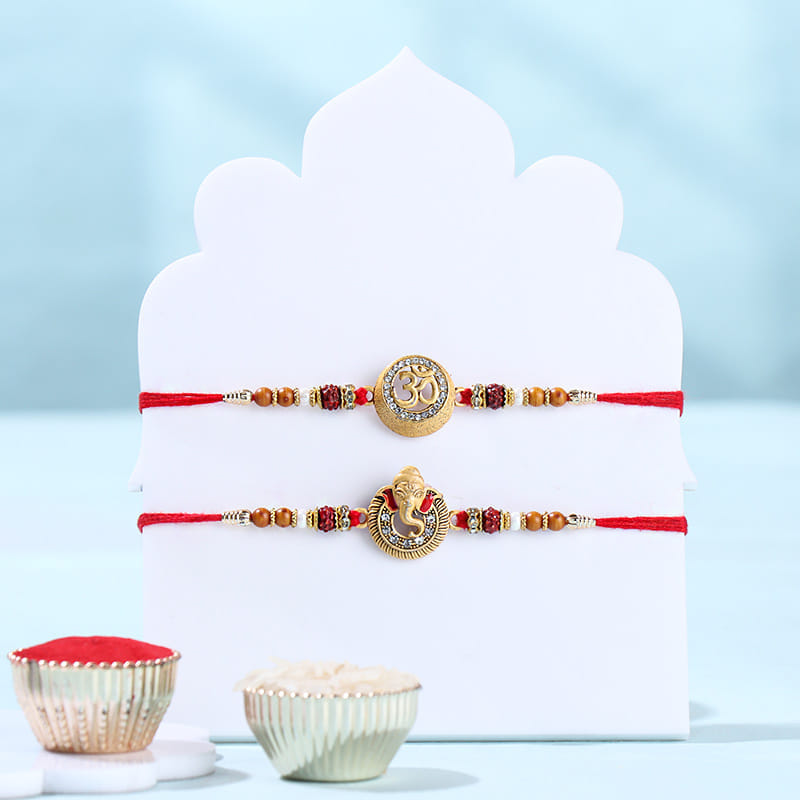 Two Divine Ganesha N Om Rakhis With Ladoos