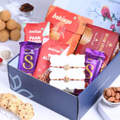 Buy Two Divine Rakhis N Tasty Treats Hampers for Brother 