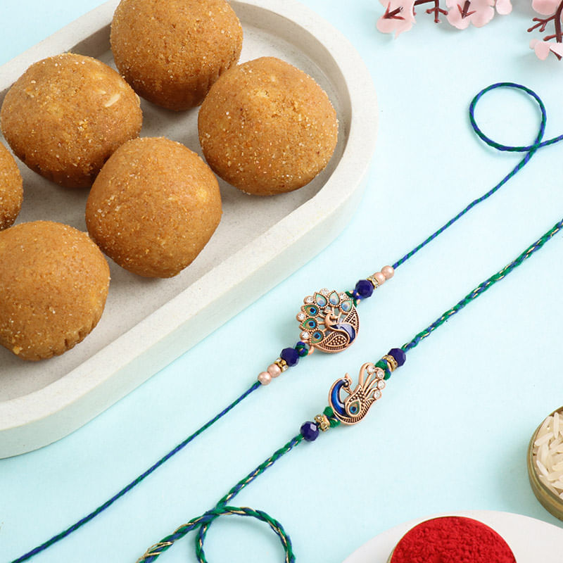 Two Embellished Peacock Rakhis With Besan Ladoos-UAE