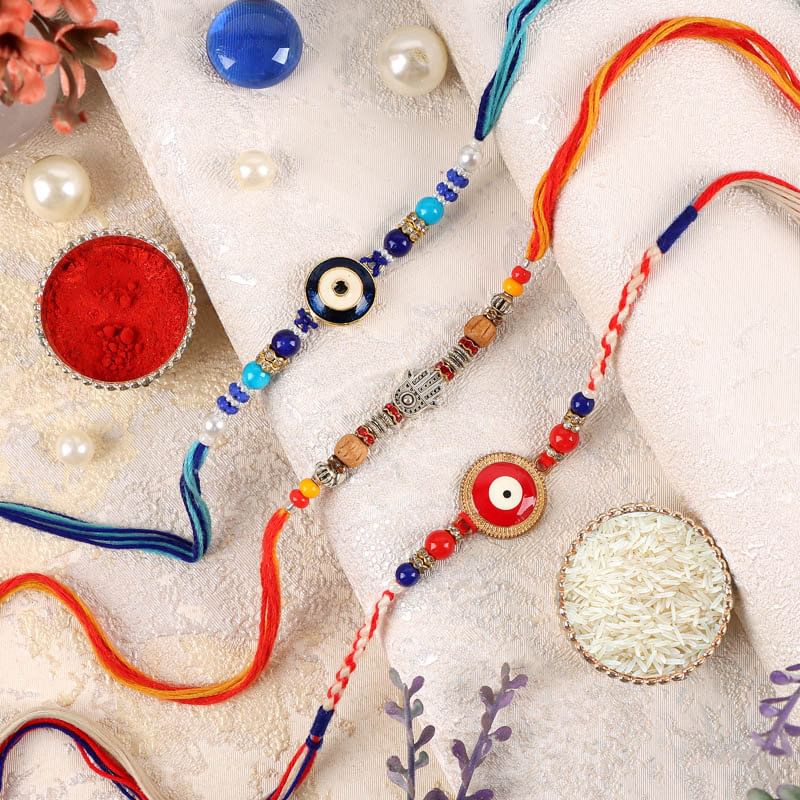 Two Evil Eye Rakhis And One Designer Rakhi