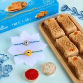 Two Evil Eye Rakhis With Milk Cake