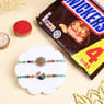 Two Floral Peacock Rakhis With Snickers