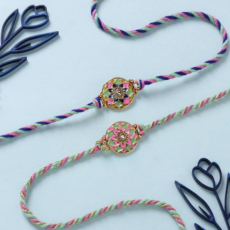 Two Floral Pearl Rakhis With Gourmet Dragees