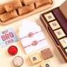 Two Floral Rakhis With Milk Cake N Chocobite