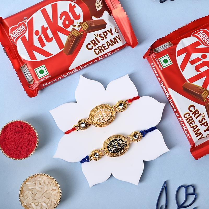 Two Golden Charm Designer Rakhis With Kitkat Bars