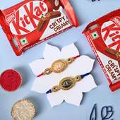 Two Golden Charm Designer Rakhis With Kitkat Bars