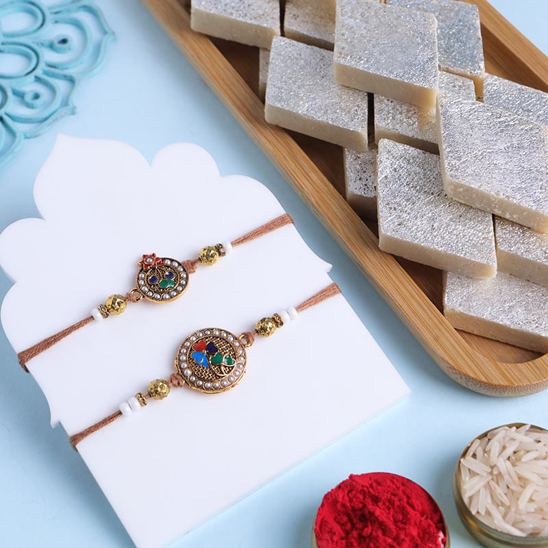 Two Golden Floral Rakhis With Kaju Katli