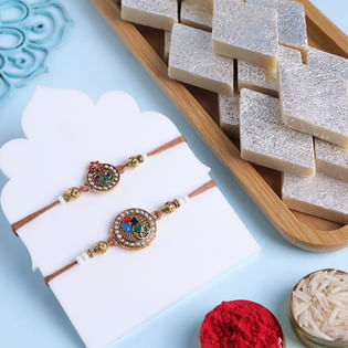 Two Golden Floral Rakhis With Kaju Katli