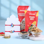 Two Graceful Peacock Rakhis With Festive Treats