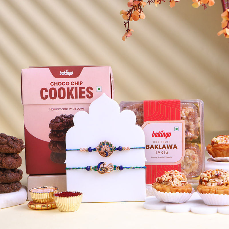 Two Peacock Rakhis With Sweet Delicacies