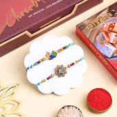 Two Peacock Rakhis With Sweets