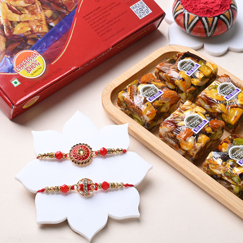 Two Red N Golden Designer Rakhis With Nut Berry