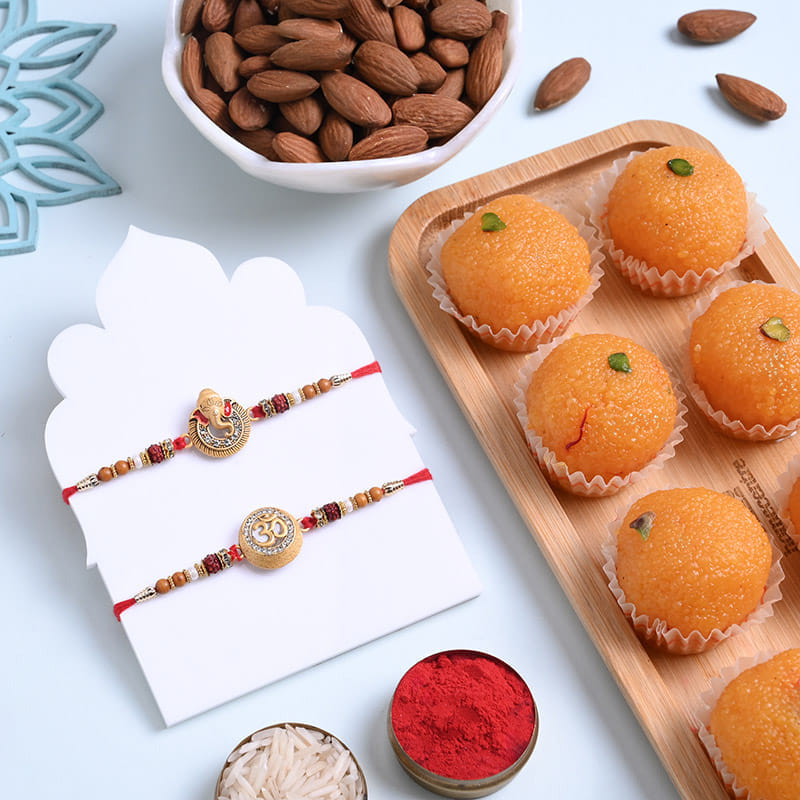 Two Sacred Rudraksha Rakhis With Almonds N Ladoos