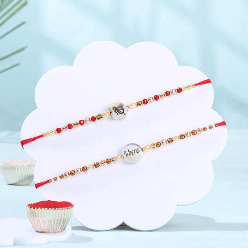 Two Sacred Symbol Rakhis With Kaju Katli