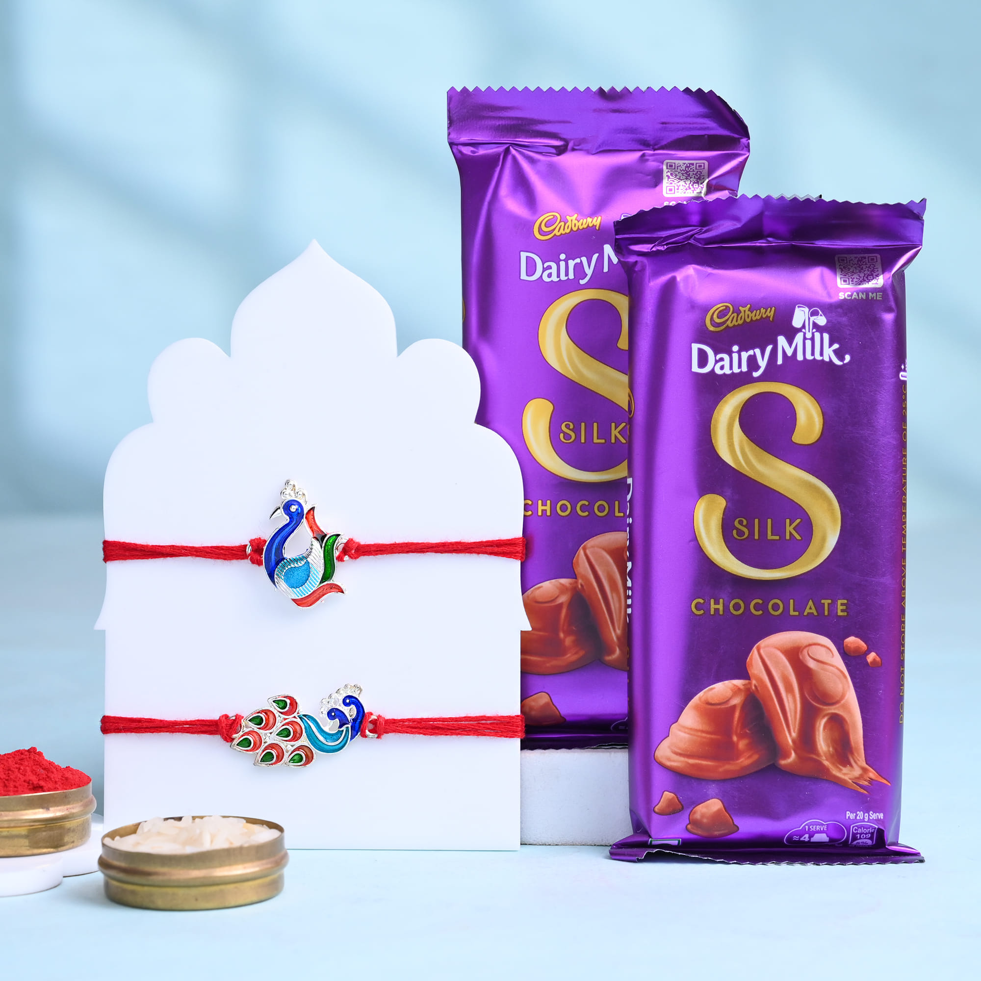 Two Sapphire Peacock Rakhi With Silk Chocolates