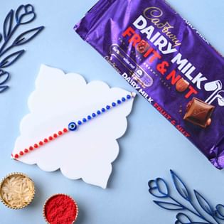 Send Evil Eye Rakhi with Cadbury Fruit & Nut Chocolate to UK 
