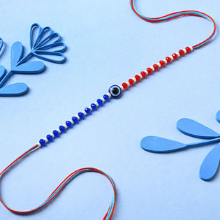 Send Evil Eye Rakhi with Cadbury Fruit & Nut Chocolate to UK 