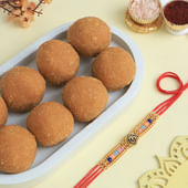 Vibrant Beaded Om Rakhi With Besan Ladoos