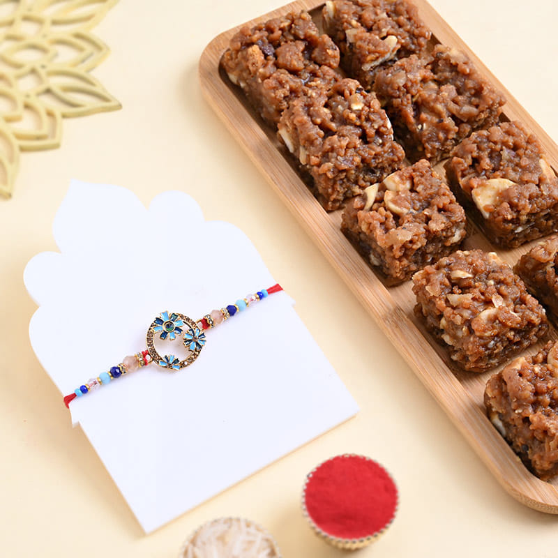 Vibrant Floral Motifs Rakhi With Dhoda Burfi