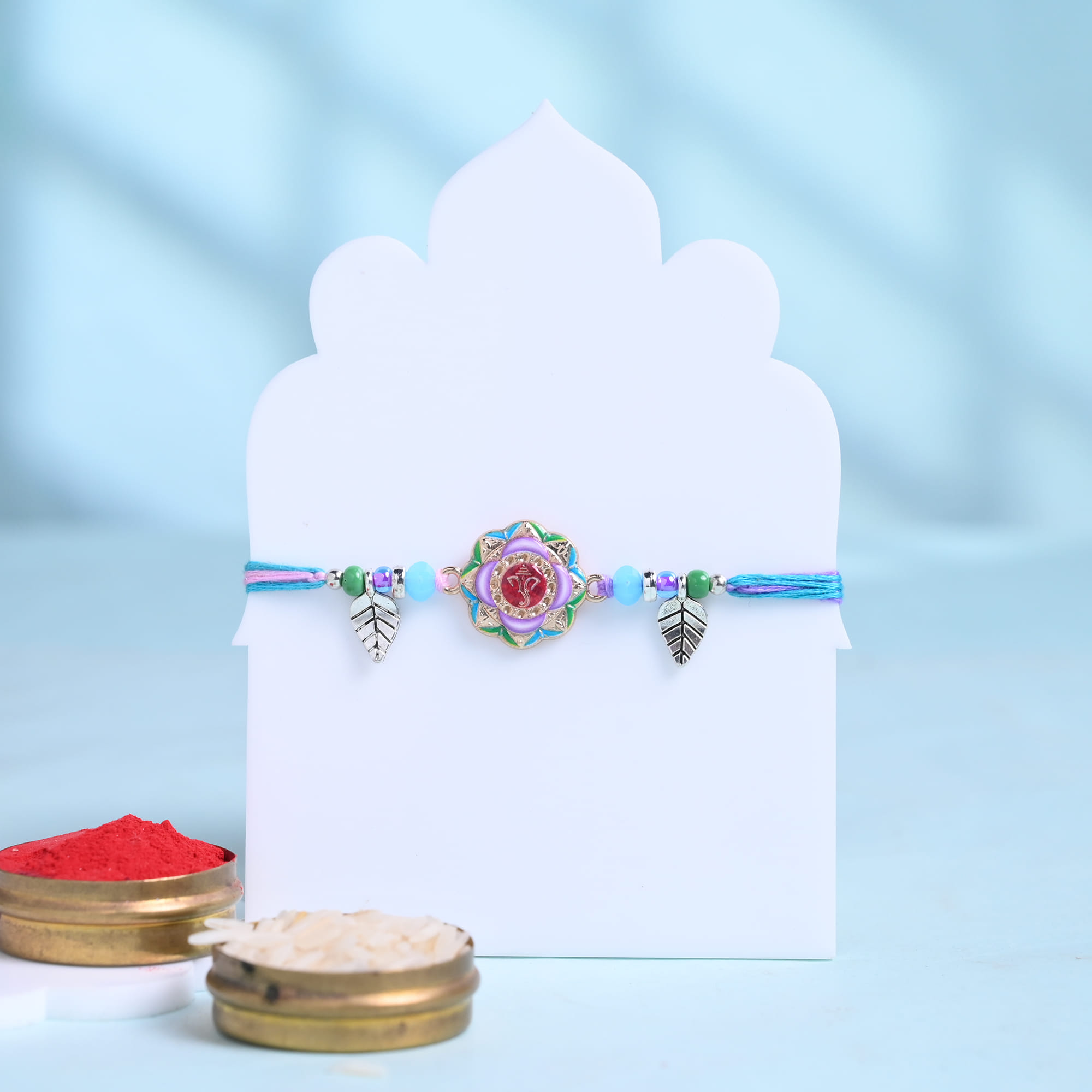 Vibrant Ganesha Rakhi With Ladoos N Chocolate