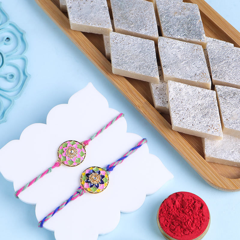 Vibrant Hues Floral Rakhi Duo With Kaju Katli-UK
