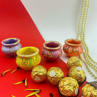 Vibrant Matki Diyas N Ferrero Rocher Chocolates
