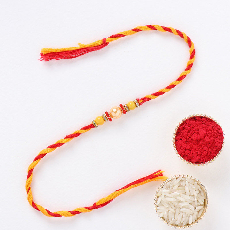 Vibrant Pearl Rakhi with Roli Chawal