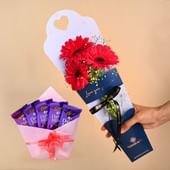 Vibrant Pink Gerberas With Chocolates