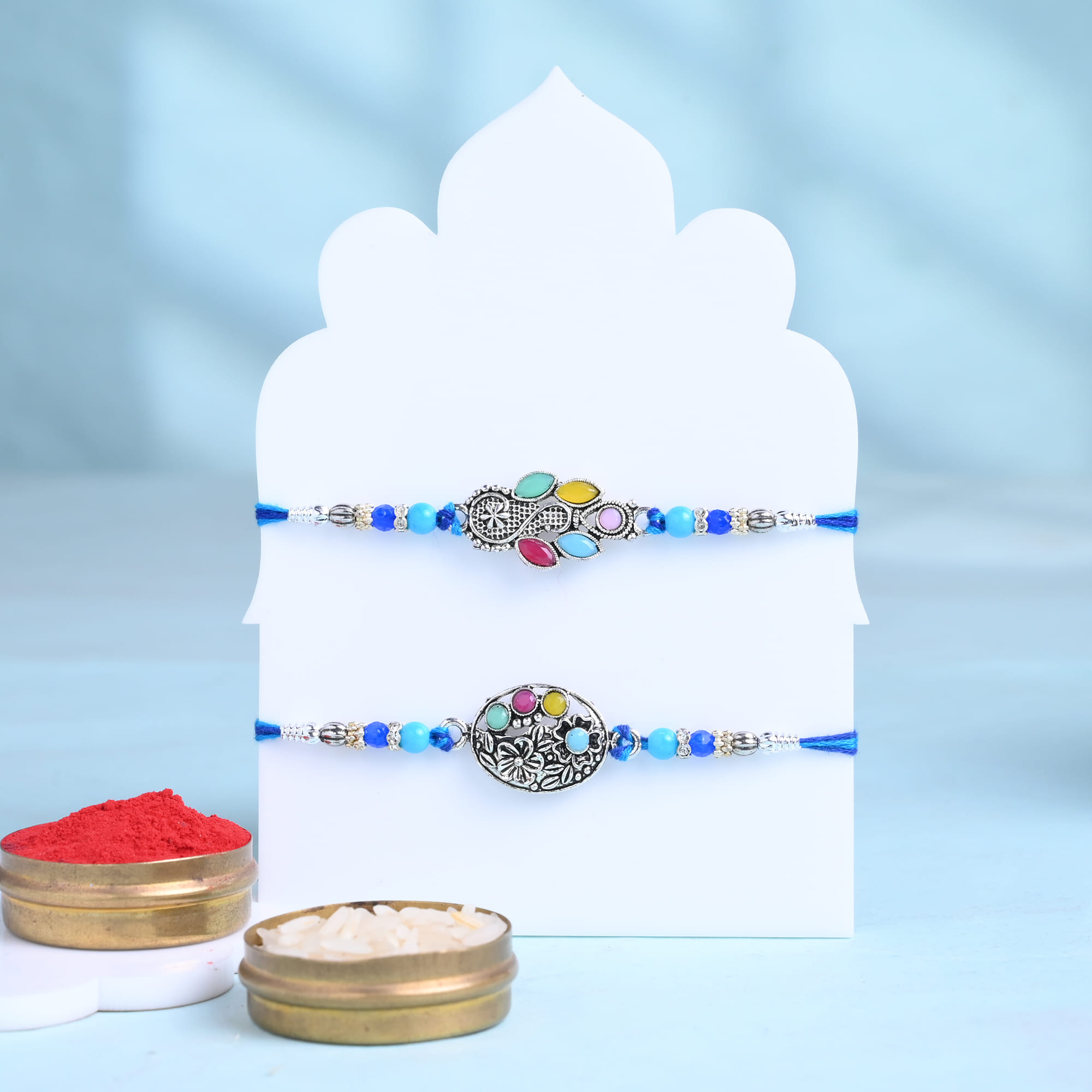 Vintage Charm Vibrant Rakhi Duo With Treats