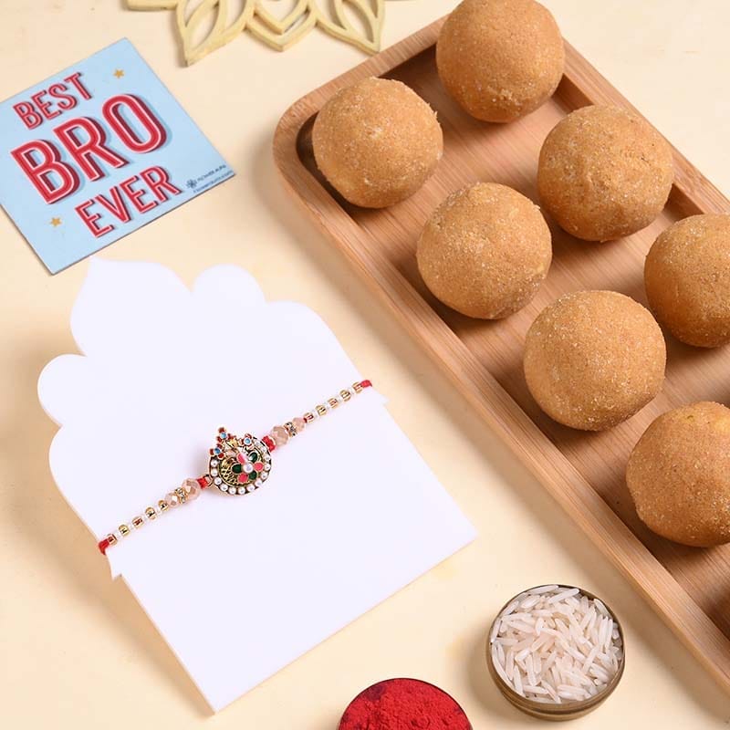Ornate Ganesha Rakhi With Besan Ladoo
