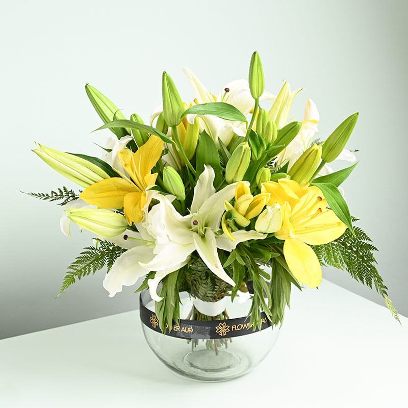 White N Bright Yellow Lilies Bunch - Arrangement of 8 White and Yellow Lilies in a Glass Vase