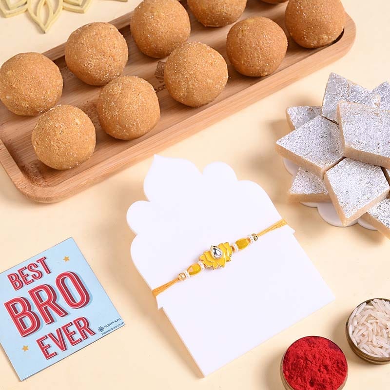 Yellow Lotus Rakhi With Kaju Katli N Besan Ladoos