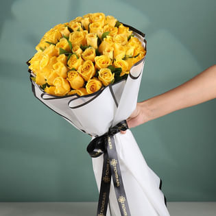 Yellow Roses Radiance In A Snowy Hug